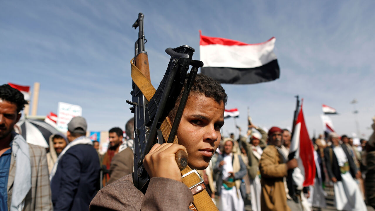 YEMEN-SECURITY/ANNIVERSARY A supporter of the Houthi movement looks as he holds up a rifle during a rally to mark the 4th anniversary of the Saudi-led military intervention in Yemen's war, in Sanaa, Yemen March 26, 2019. REUTERS/Khaled Abdullah - RC1A7AFBD220