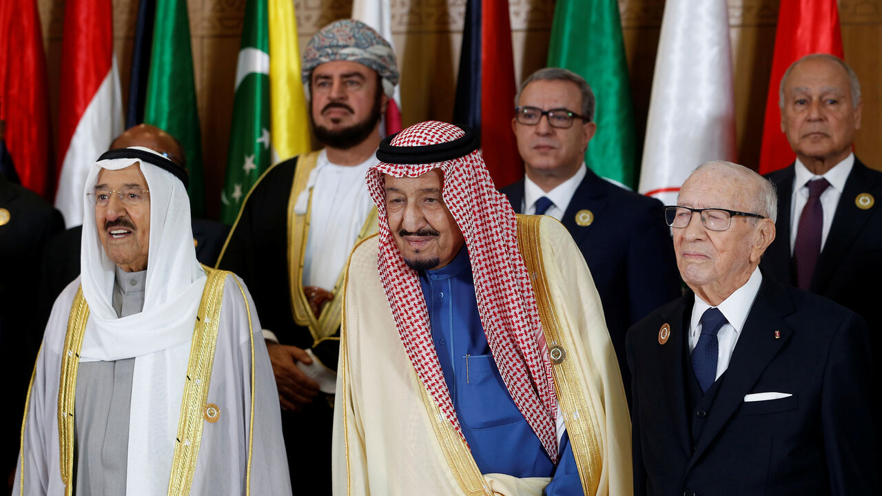TUNISIA-ARABS/SUMMIT Tunisian President Beji Caid Essebsi stands with Saudi Arabia's King Salman bin Abdulaziz and Emir of Kuwait Sabah Al-Ahmad Al-Jaber Al-Sabah during the group photo with Arab leaders, ahead of the 30th Arab Summit in Tunis, Tunisia March 31, 2019. REUTERS/Zoubeir Souissi/Pool - RC17FA0F57C0