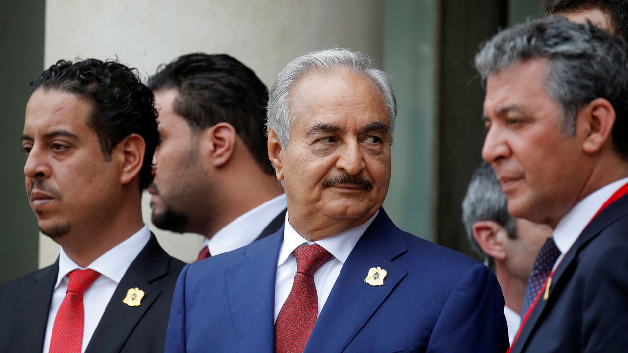 LIBYA-SECURITY/MEETING Khalifa Haftar (C), the military commander who dominates eastern Libya, leaves after an international conference on Libya at the Elysee Palace in Paris, France, May 29, 2018. REUTERS/Philippe Wojazer - RC1C86F2EC00