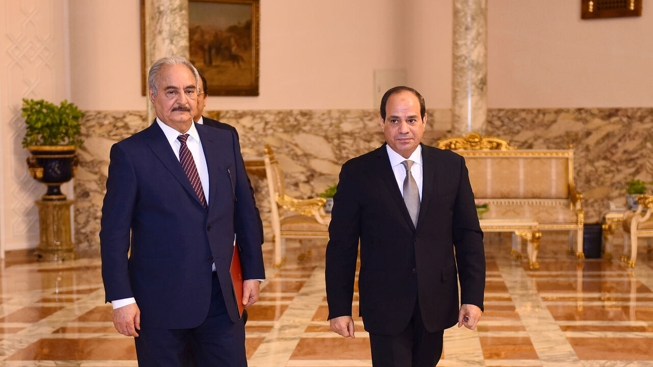 LIBYA-SECURITY/ Libyan military commander Khalifa Haftar walks with Egyptian President Abdel Fattah al-Sisi at the Presidential Palace in Cairo, Egypt April 14, 2019 in this handout picture courtesy of the Egyptian Presidency. The Egyptian Presidency/Handout via REUTERS ATTENTION EDITORS - THIS IMAGE WAS PROVIDED BY A THIRD PARTY. - RC1F3D59FD40