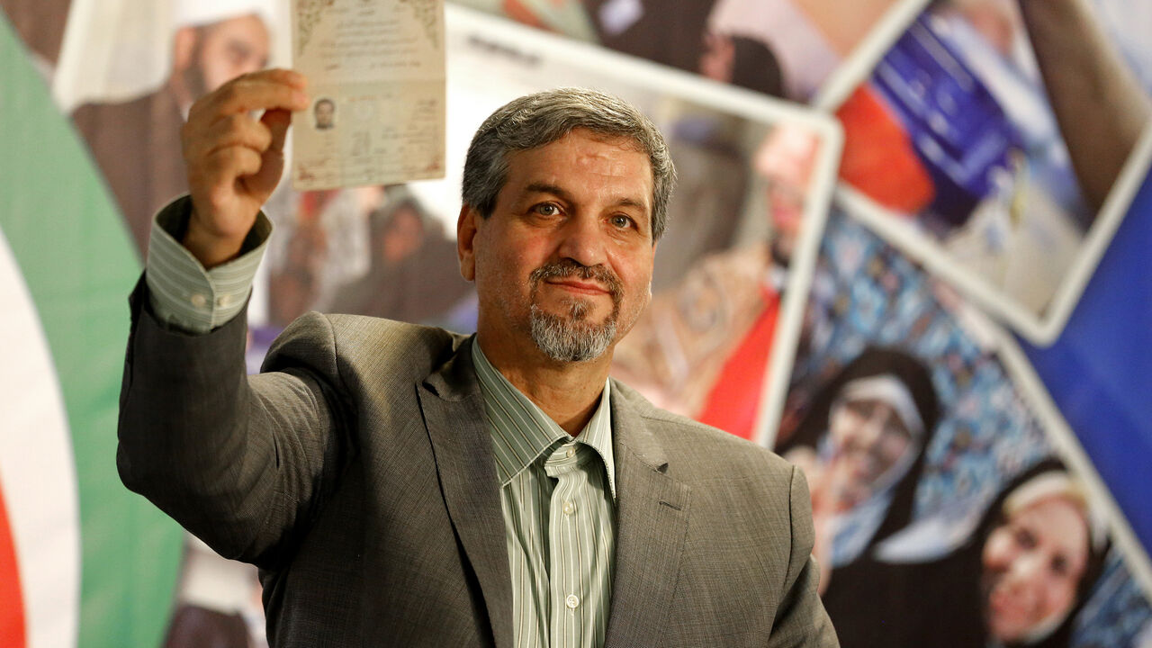 668501886 Iranian reformist MP, Mostafa Kavakebian, poses after registering his candidacy for the upcoming presidential elections at the ministry of interior in the capital Tehran on April 14, 2017. / AFP PHOTO / ATTA KENARE (Photo credit should read ATTA KENARE/AFP/Getty Images)