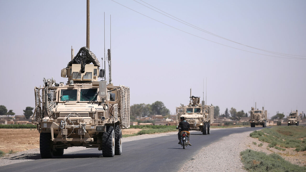 MIDEAST-CRISIS/SYRIA-RAQQA A U.S military convoy is seen on the main road in Raqqa, Syria July 31, 2017. REUTERS/ Rodi Said - RC1664C87120