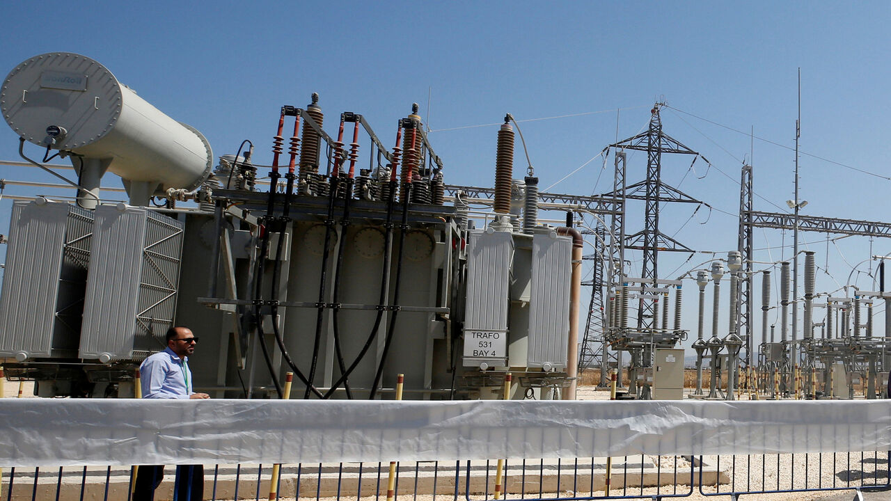 A worker walks in the new electrical substation near the West Bank city of Jenin July 10, 2017. REUTERS/Abed Omar Qusini - RC1E2622DFF0