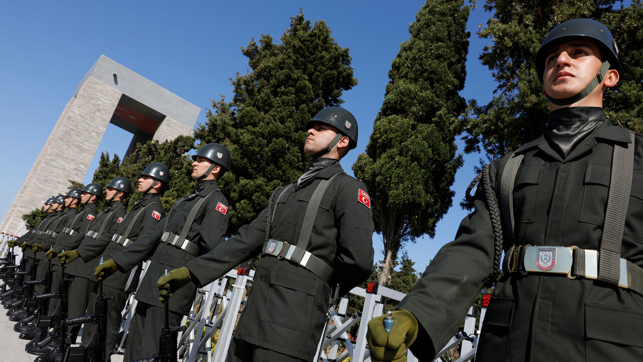 ANZAC-DAY/TURKEY Turkish soldiers stand in front of the Turkish memorial during an international service marking the 103rd anniversary of the World War I campaign in Gallipoli, Turkey, April 24, 2018. REUTERS/Umit Bektas - RC1E56201C10