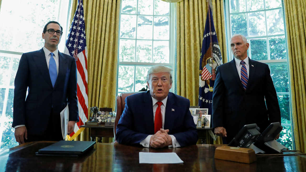 U.S. President Trump announces new sanctions on Iran in the Oval Office at the White House in Washington U.S. President Donald Trump speaks before signing an executive order imposing fresh sanctions on Iran as Treasury Secretary Steven Mnuchin and Vice President Mike Pence look on in the Oval Office of the White House in Washington, U.S., June 24, 2019. REUTERS/Carlos Barria - RC1D3FDB52D0