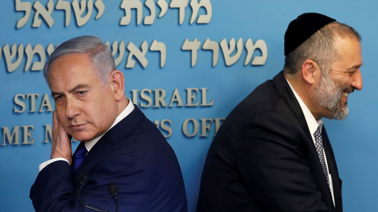 ISRAEL-MIGRANTS/ Israeli Prime Minister Benjamin Netanyahu and Israeli Interior Minister Aryeh Deri are seen at the end of a news conference at the Prime Minister's office in Jerusalem April 2, 2018. REUTERS/Ronen Zvulun - RC163EB70890