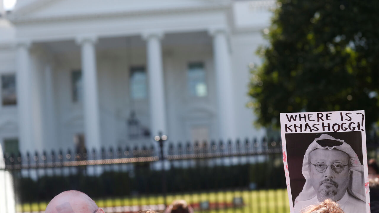 SAUDI-POLITICS/DISSIDENT-PROTEST An activist holds an image of missing Saudi journalist Jamal Khashoggi during a demonstration calling for sanctions against Saudi Arabia and to protest Khashoggi's disappearance, outside the White House in Washington, U.S., October 19, 2018. REUTERS/Leah Millis - RC1F626030D0