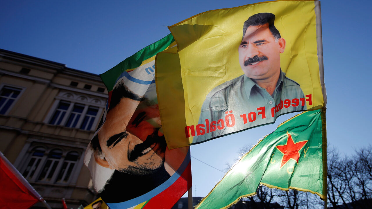 MIDEAST-CRISIS/FRANCE-KURDS Pro-Kurd protesters hold flags with portraits of jailed Kurdistan Workers Party (PKK) leader Abdullah Ocalan as they take part in a demonstration in support to him in Strasbourg, France, February 16, 2019. REUTERS/Vincent Kessler - RC12D7661100