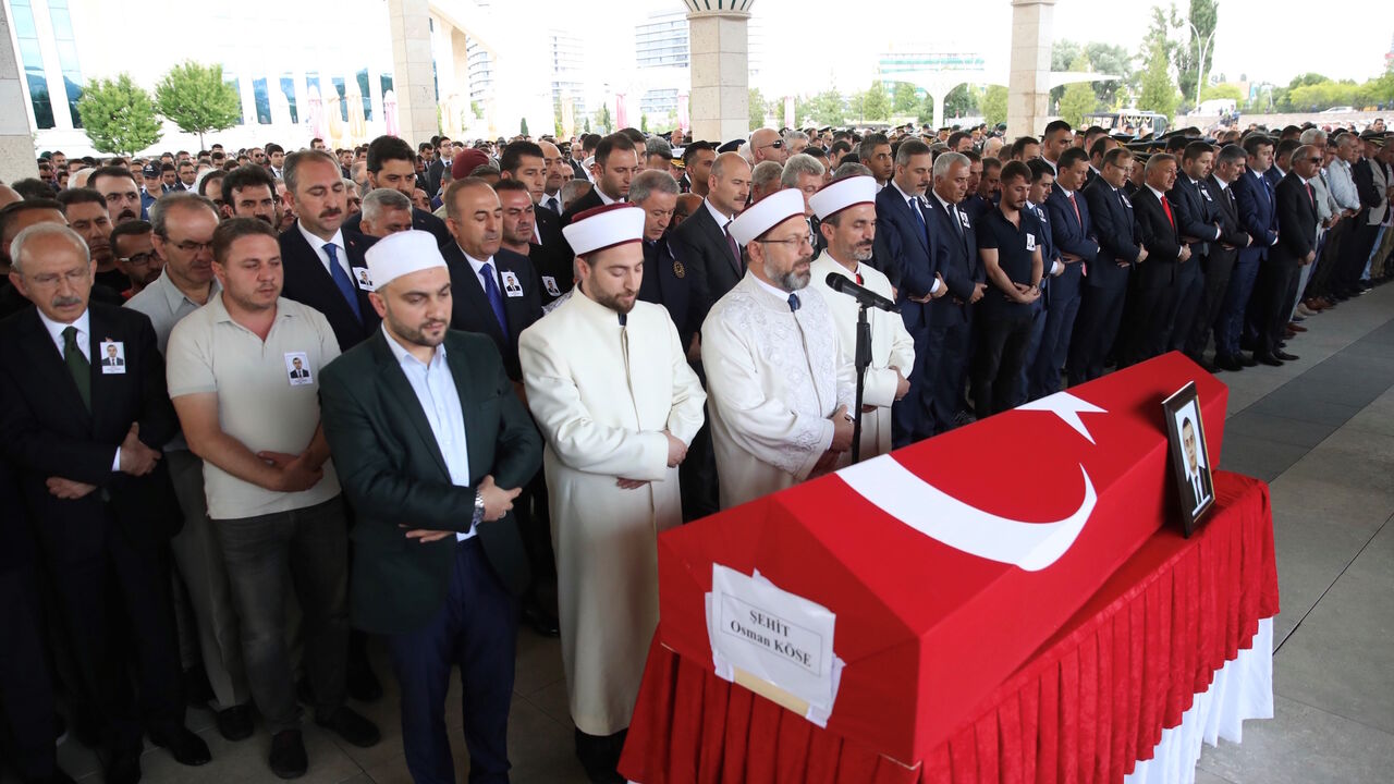1156345980 ANKARA, TURKEY - JULY 18: Chairman of the Republican People's Party (CHP) Kemal Kilicdaroglu, Turkish Interior Minister Suleyman Soylu, Turkish Foreign Minister Mevlut Cavusoglu, Turkish Justice Minister Abdulhamit Gul, Head of the National Intelligence Organization (MIT) of Turkey Hakan Fidan and Grand Unity Party (BBP) Chairman Mustafa Destici attend the funeral of Turkish diplomat Osman Kose, who was martyred in an armed attack in Iraq's Erbil, at Ahmet Hamdi Akseki Mosque in Ankara, Turkey on July 18, 2
