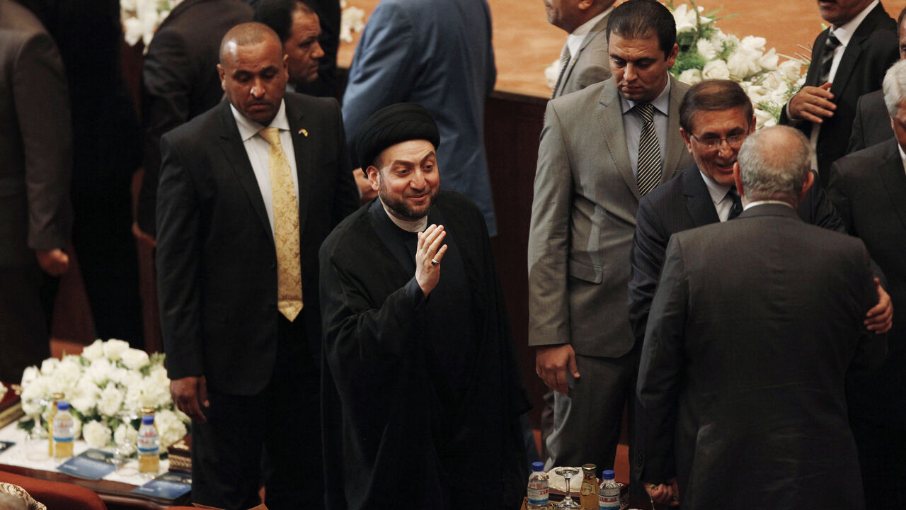 IRAQ-CRISIS/POLITICS Ammar al-Hakim (C), leader of the Islamic Supreme Council of Iraq (ISCI), attends a parliament session at the parliament headquarters in Baghdad September 8, 2014. Iraq's parliament approved a new government headed by Haider al-Abadi as prime minister on Monday night, in a bid to rescue Iraq from collapse, with sectarianism and Arab-Kurdish tensions on the rise. REUTERS/Ahmed Saad (IRAQ - Tags - Tags: POLITICS ELECTIONS RELIGION) - GM1EA990L3001
