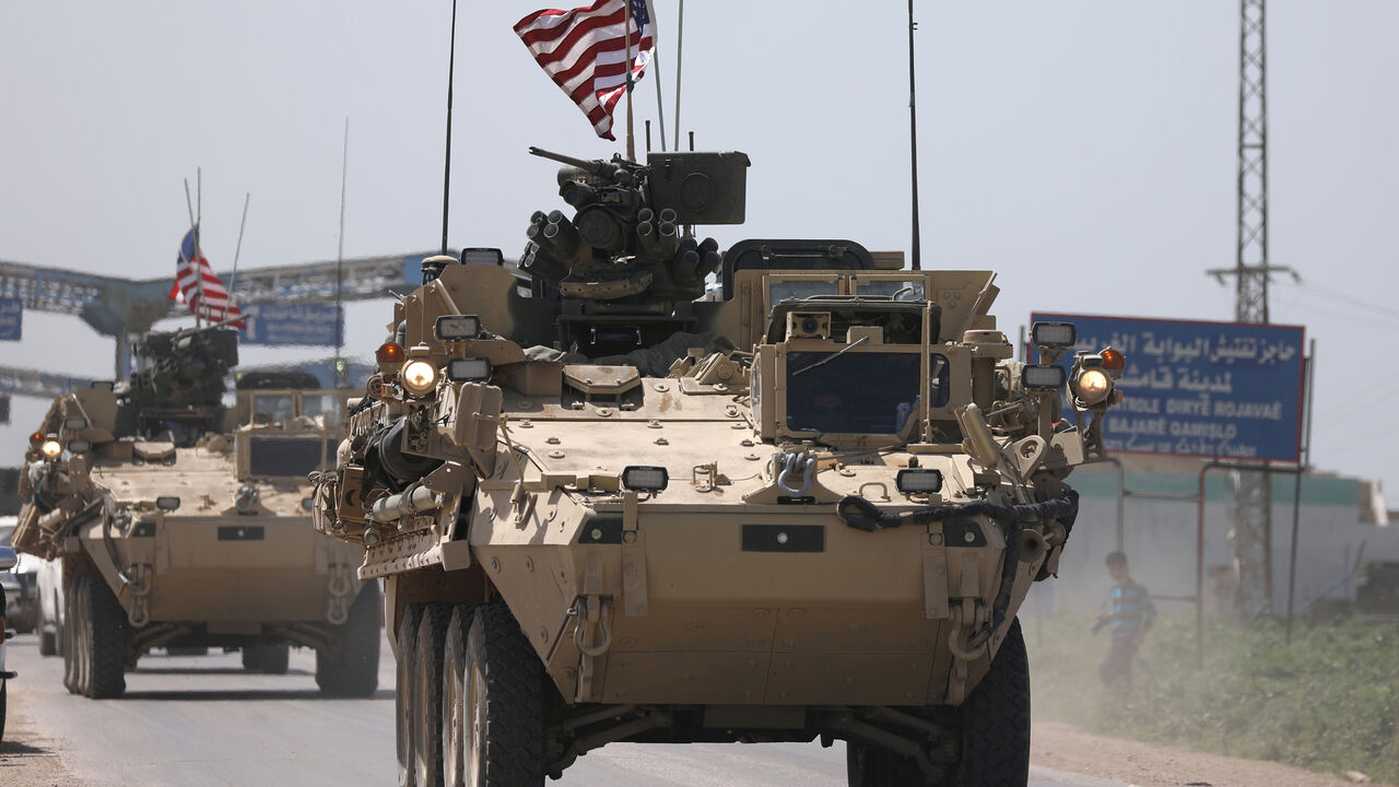 MIDEAST-CRISIS/SYRIA-KURDS U.S military vehicles travel in the northeastern city of Qamishli, Syria April 29, 2017. Picture taken April 29, 2017. REUTERS/Rodi Said - RC1FC8E9DC90