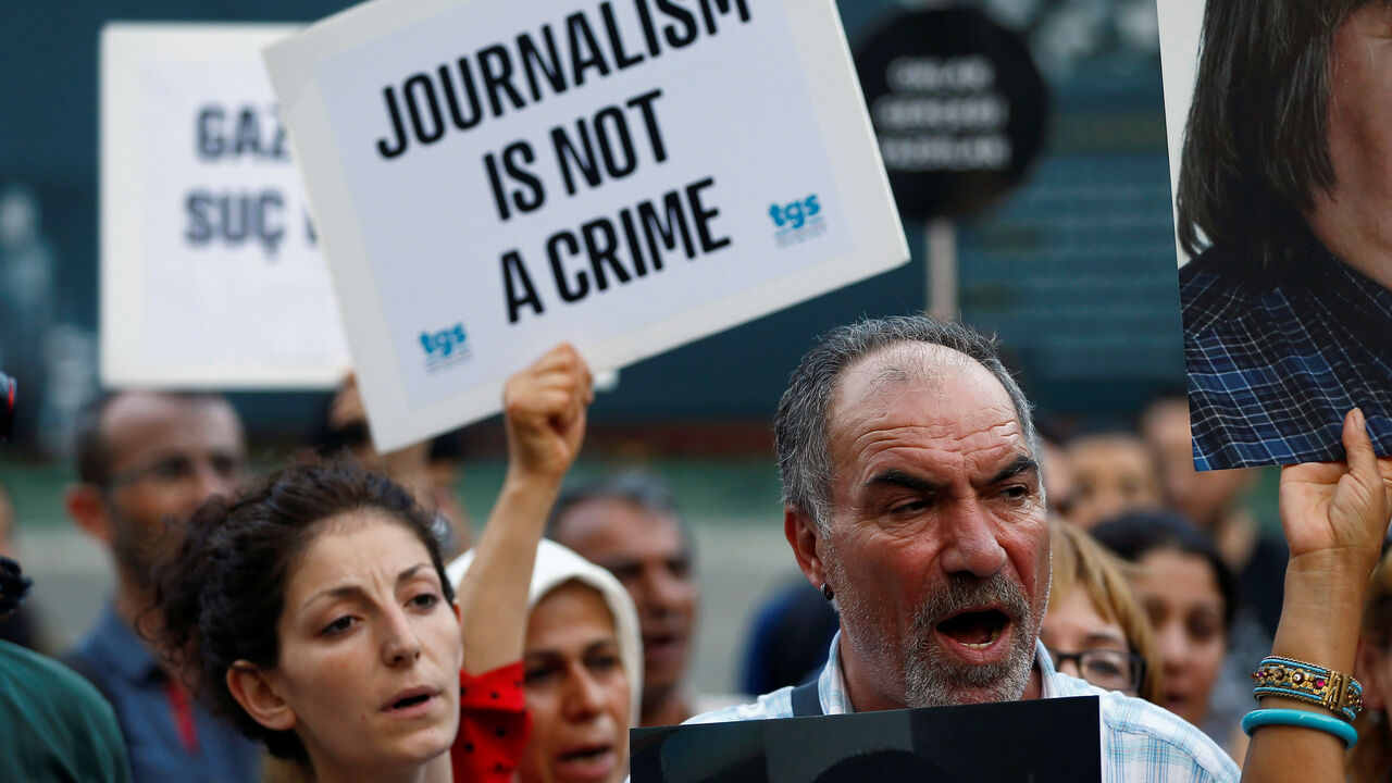 Demonstrators shout slogans during a protest against the arrest of three prominent activists for press freedom, in central Istanbul Demonstrators shout slogans during a protest against the arrest of three prominent activists for press freedom, in central Istanbul,Turkey, June 21, 2016. REUTERS/Osman Orsal - S1AETLFKIGAA