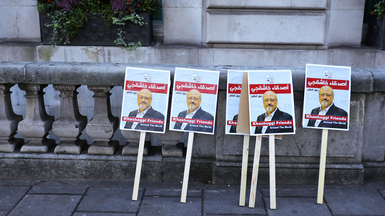 SAUDI-KHASHOGGI/BRITAIN Placards can be seen outside the embassy as people protest against the killing of journalist Jamal Khashoggi in Turkey outside the Saudi Arabian Embassy in London, Britain, October 26 2018. REUTERS/Simon Dawson - RC1CC0BA7F80