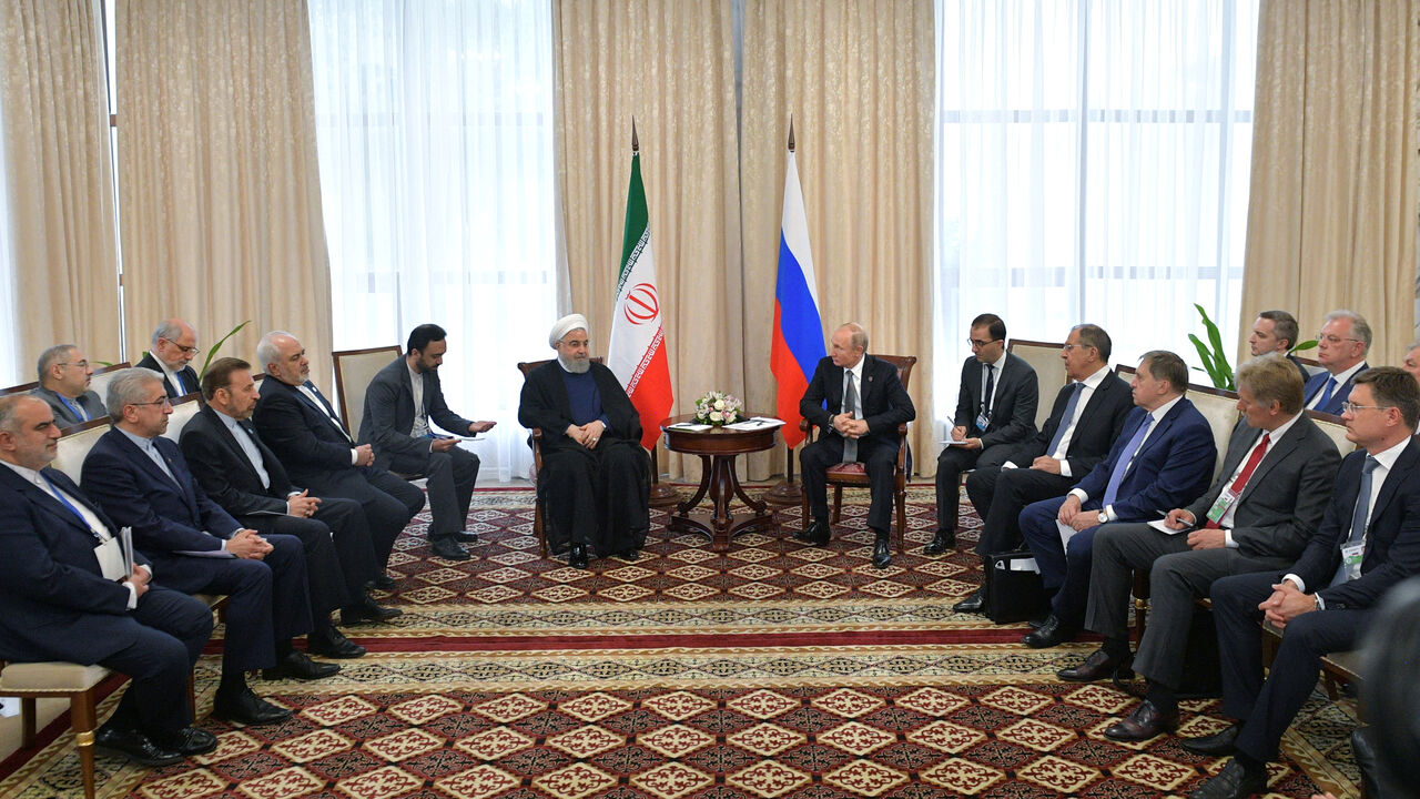 KYRGYZSTAN-SCO/PUTIN-ROUHANI Russia's President Vladimir Putin and Iran's President Hassan Rouhani attend a meeting on the sidelines of the Shanghai Cooperation Organisation (SCO) summit in Bishkek, Kyrgyzstan June 14, 2019. Sputnik/Alexei Druzhinin/Kremlin via REUTERS ATTENTION EDITORS - THIS IMAGE WAS PROVIDED BY A THIRD PARTY. - RC1D5FA36790