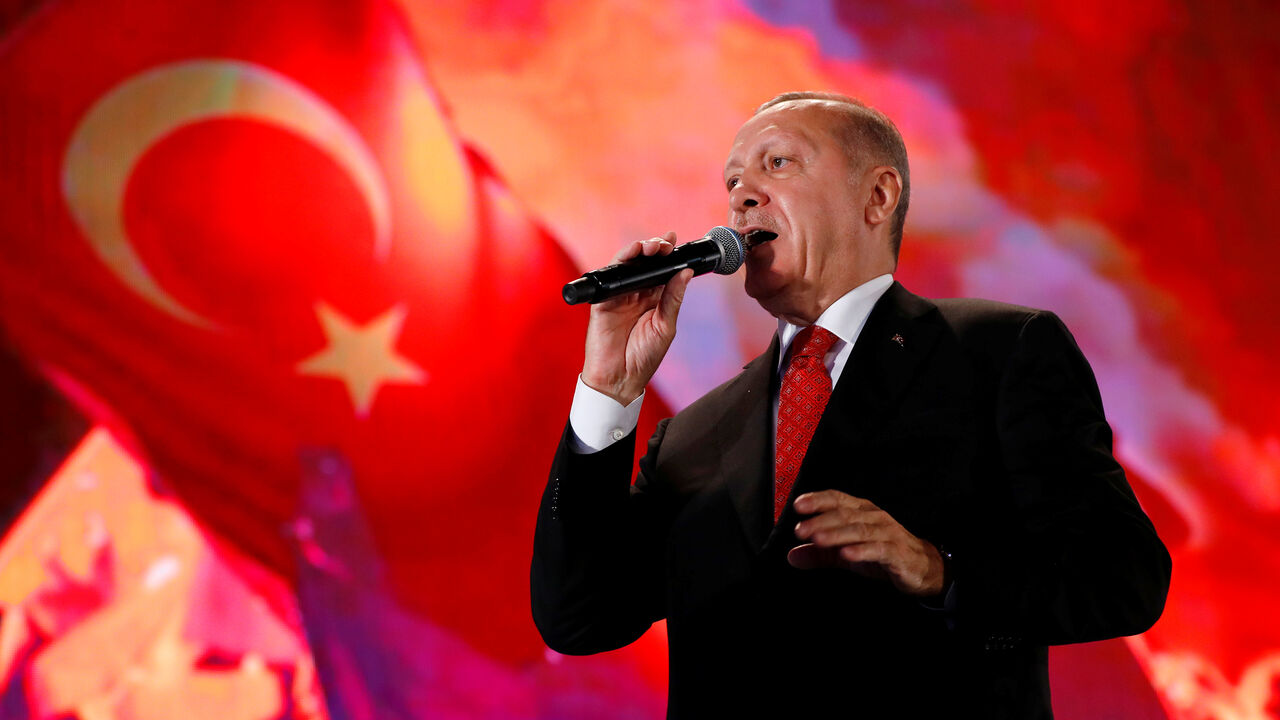 TURKEY-SECURITY/ Turkish President Tayyip Erdogan addresses his supporters during a ceremony marking the third anniversary of the attempted coup at Ataturk Airport in Istanbul, Turkey, July 15, 2019. REUTERS/Murad Sezer - RC1C09129690