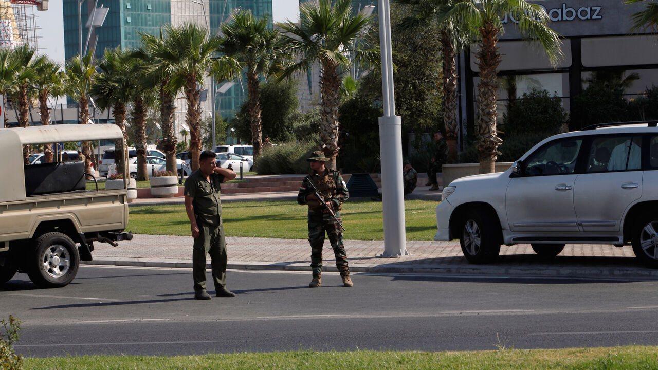 IRAQ-SECURITY/ Kurdish security members stand guard near a restaurant where Turkish diplomats and Turkish consulate employee were killed in Erbil, Iraq July 17, 2019. REUTERS/Azad Lashkari - RC15FE0B8D60