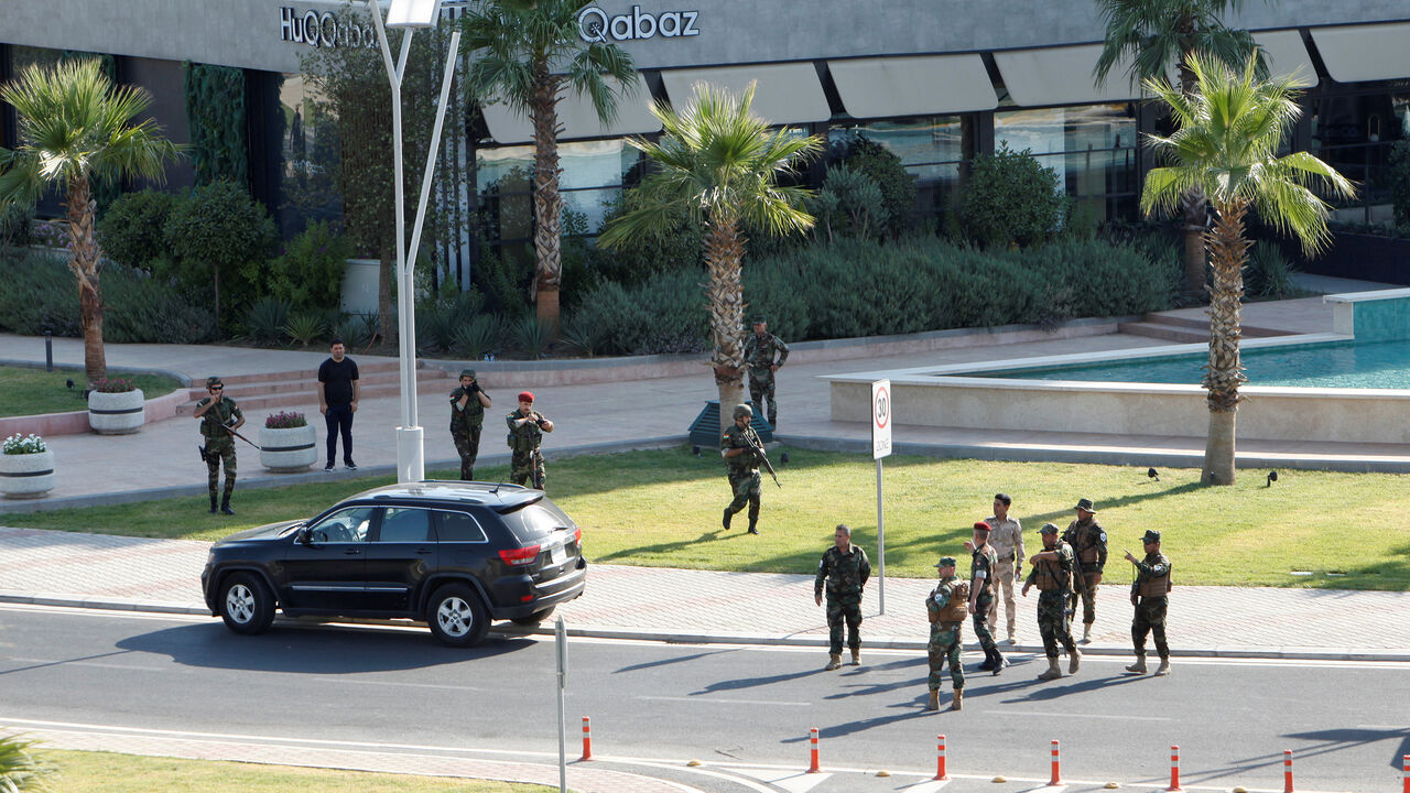 IRAQ-SECURITY/ Kurdish security members gather near a restaurant where Turkish diplomats and Turkish consulate employee were killed in Erbil, Iraq July 17, 2019. REUTERS/Azad Lashkari - RC1302A043E0