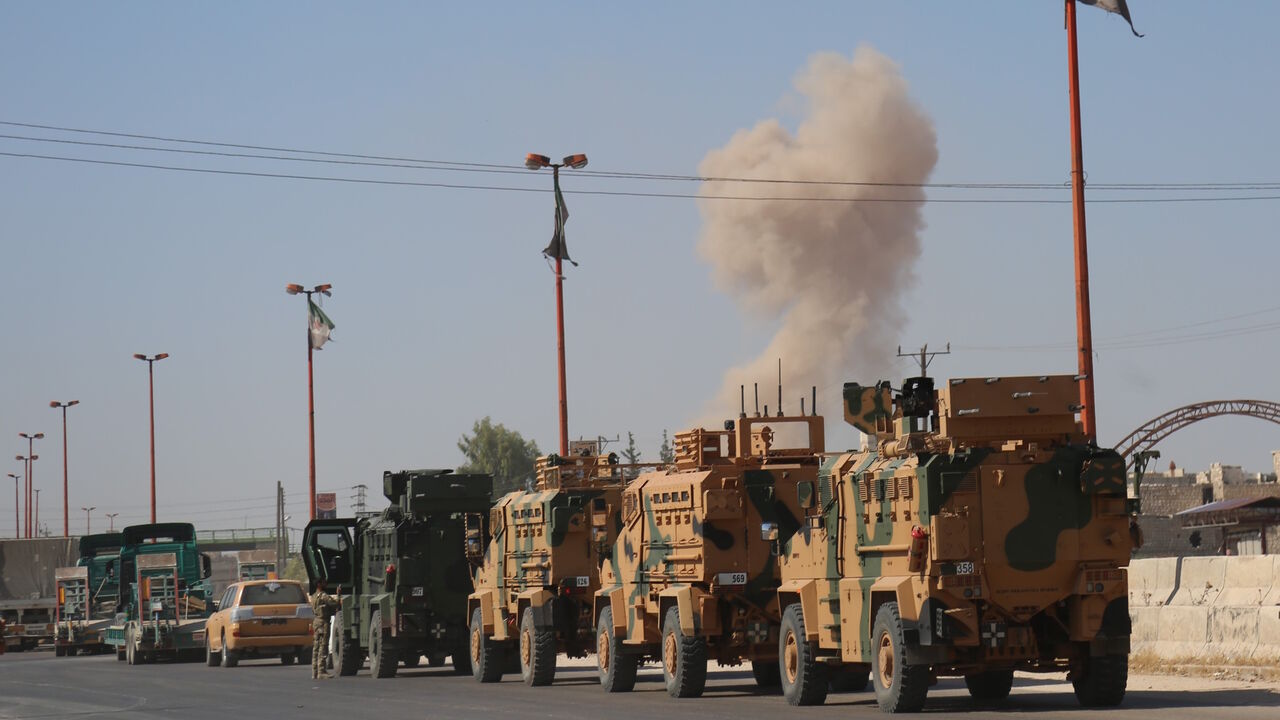 1162663202 IDLIB, SYRIA - AUGUST 19: Turkish military convoy is seen on August 19, 2019 in Syria's northern province of Idlib. Syrian regime launches airstrikes on Maarat Al-Numan town as a convoy of Turkish military vehicles passes through the town. An airstrike killed three civilians and injured 12 others during a transfer to Turkeys observation point in Syrias Idlib.
(Photo by Izzettin Idilbi/Anadolu Agency via Getty Images)
