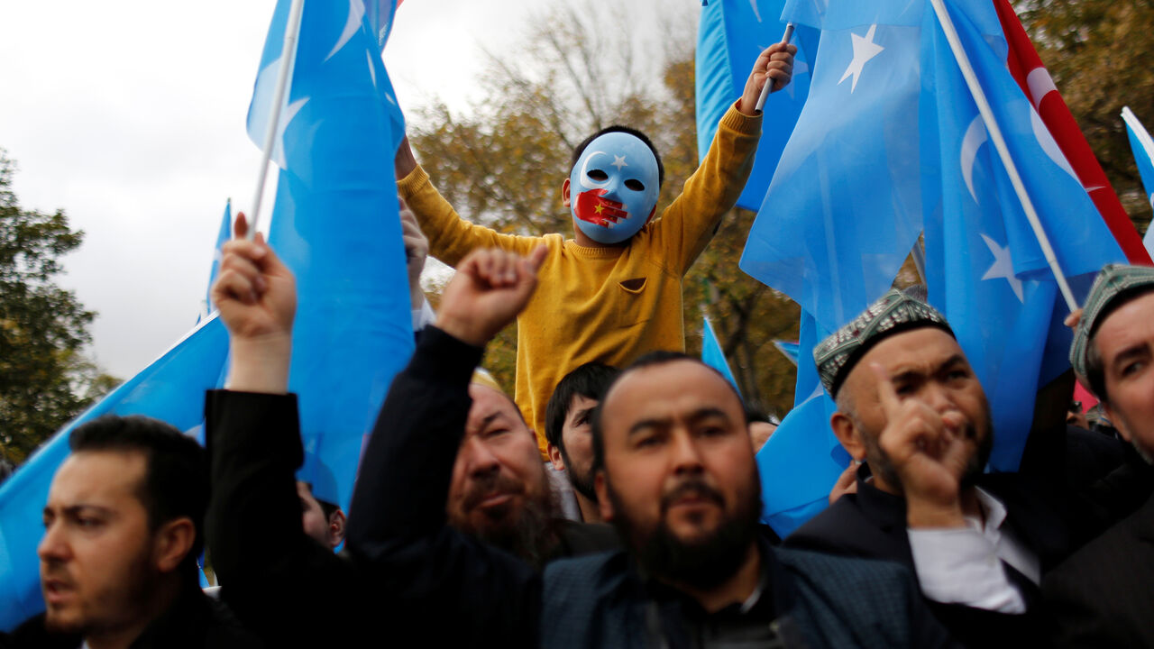 CHINA-XINJIANG/TURKEY A masked Uighur boy takes part in a protest against China, at the courtyard of Fatih Mosque, a common meeting place for pro-Islamist demonstrators in Istanbul, Turkey, November 6, 2018. REUTERS/Murad Sezer SEARCH "SEZER NOURMUHAMMED" FOR THIS STORY. SEARCH "WIDER IMAGE" FOR ALL STORIES. TPX IMAGES OF THE DAY. - RC1EFCCF5820