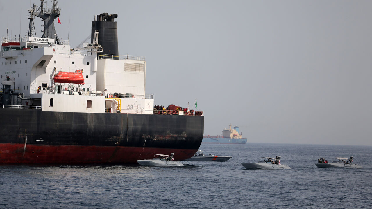 SAUDI-OIL/EMIRATES-TANKER UAE Navy boats are seen next to Al Marzoqah, Saudi Arabian tanker, off the Port of Fujairah, UAE May 13, 2019.REUTERS/Satish Kumar - RC1AA0D0CE30