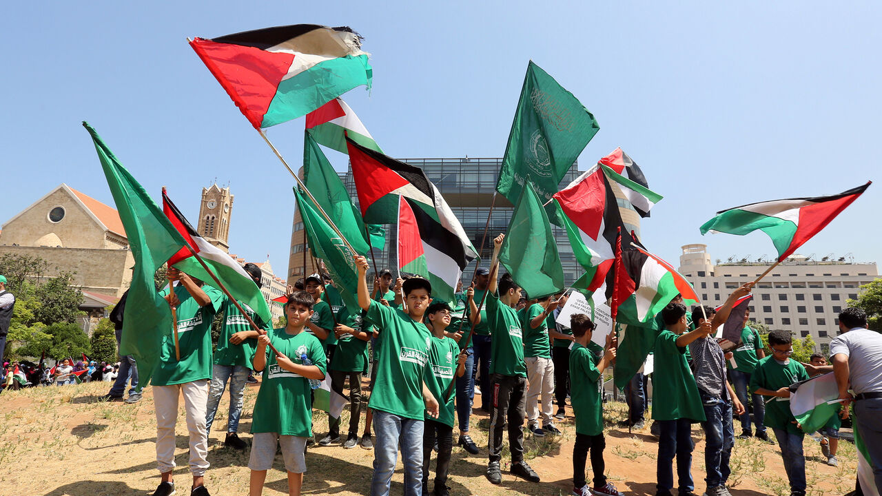 Demonstrators hold Palestinian flags as they take part in a protest against Bahrain's conference about U.S. President Donald Trump's vision for Mideast peace plan, in front of the U.N. headquarters, in Beirut, Lebanon, June 25, 2019. REUTERS/Aziz Taher - RC13E44861E0