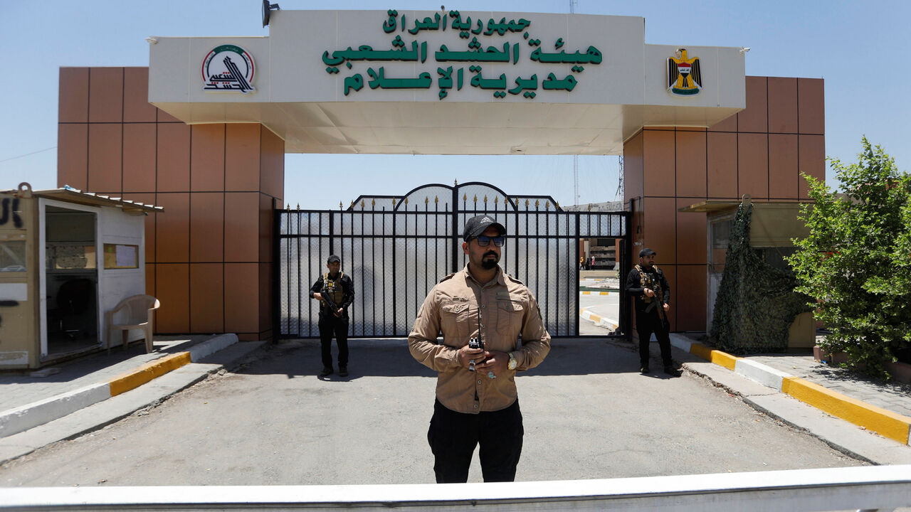 USA-IRAN/IRAQ Members of Iraqi Popular Mobilization Forces (PMF) stand guard at Popular Mobilization Forces Media Center in Baghdad, Iraq July 2, 2019. REUTERS/Khalid Al-Mousily - RC11A11145C0
