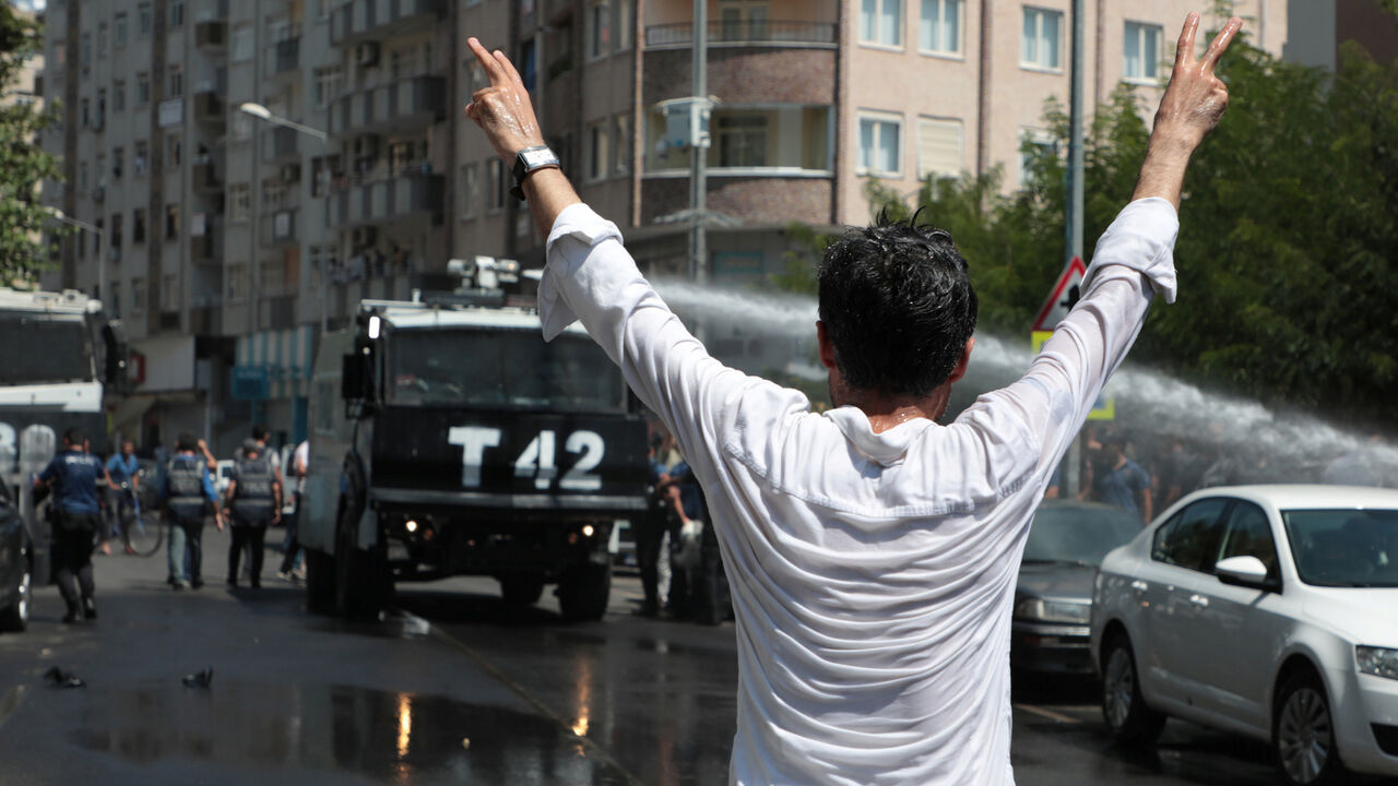 Turkish police use a water cannon to disperse demonstrators during a protest against the replacement of Kurdish mayors with state officials in three cities, in Diyarbakir Turkish police use a water cannon to disperse demonstrators during a protest against the replacement of Kurdish mayors with state officials in three cities, in Diyarbakir, Turkey, August 19, 2019. REUTERS/Sertac Kayar - RC1908CDAB50