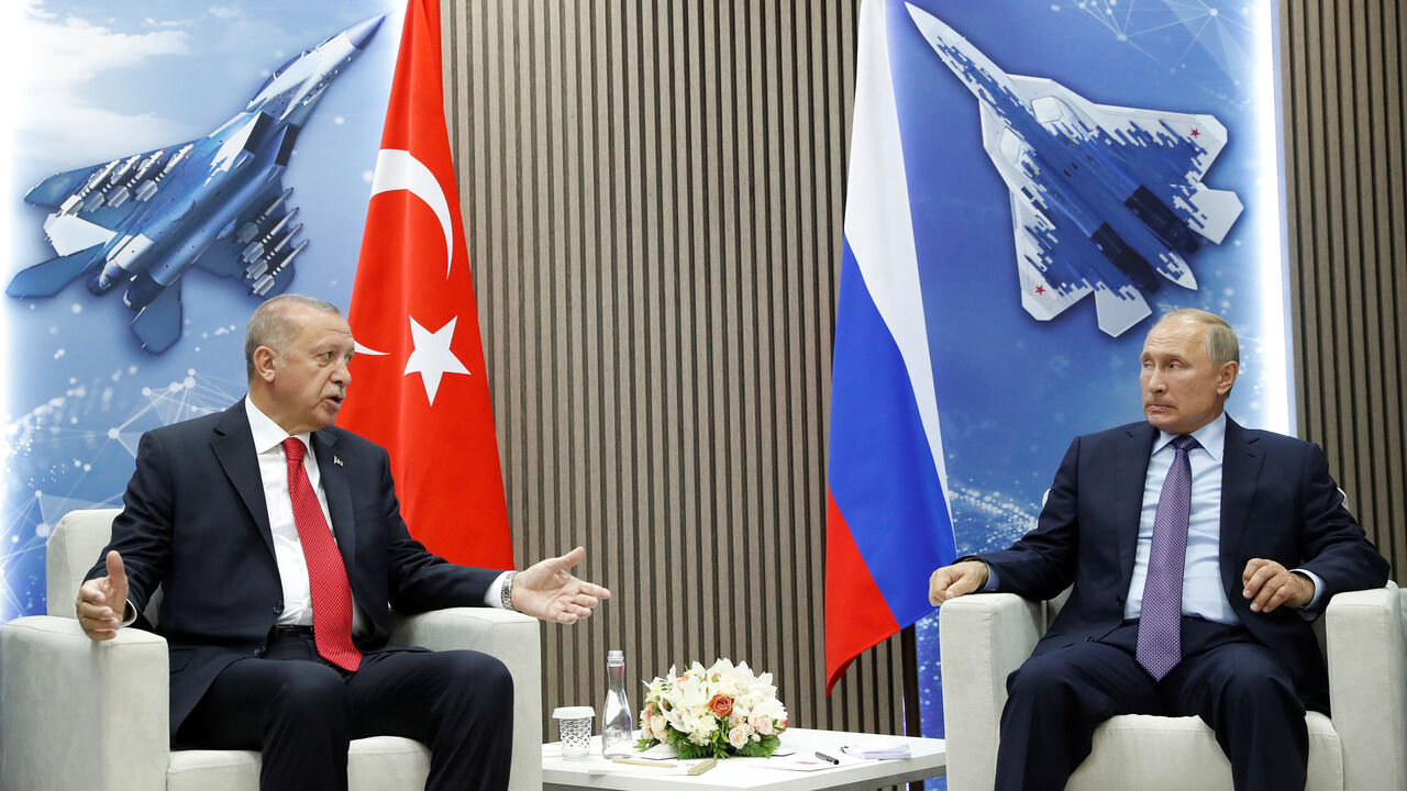RUSSIA-TURKEY/ Russian President Vladimir Putin and Turkish President Recep Tayyip Erdogan speak during their meeting on the sidelines of the MAKS-2019 International Aviation and Space Salon in Zhukovsky outside Moscow, Russia, August 27, 2019. Maxim Shipenkov/Pool via REUTERS - RC147D99BA60