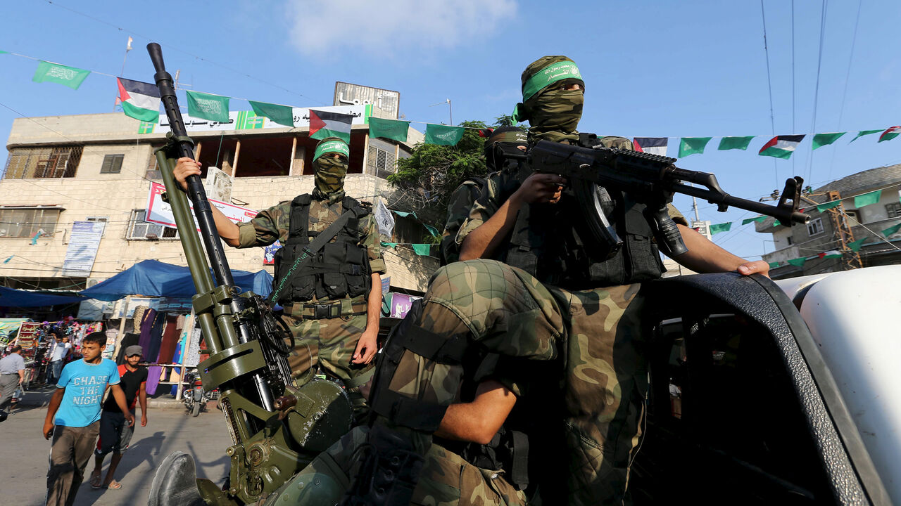 ISRAEL-PALESTINIANS/ Palestinian members of the al-Qassam Brigades, the armed wing of the Hamas movement, take part in an anti-Israel parade in Rafah, in the southern Gaza Strip July 13, 2015. REUTERS/Ibraheem Abu Mustafa
- GF10000158040