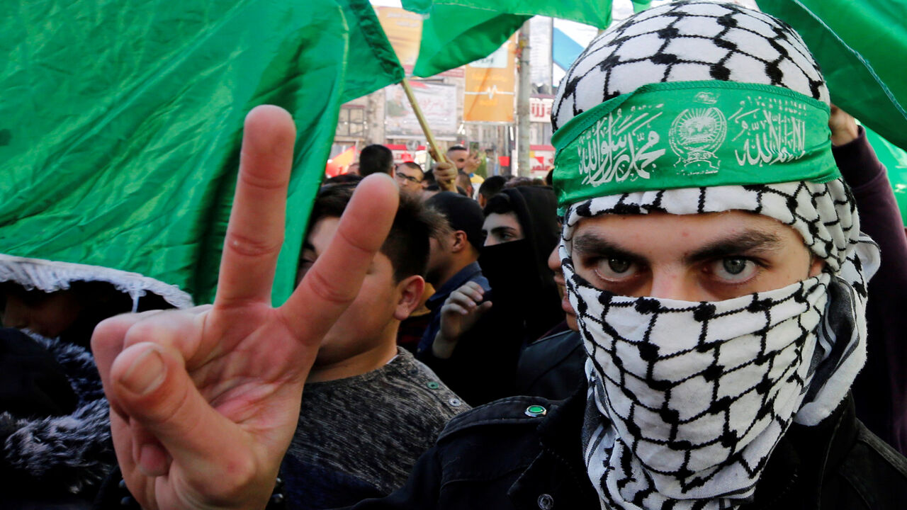 A Palestinian Hamas supporter gestures during a rally marking the 31st anniversary of Hamas' founding, in Nablus in the Israeli-occupied West Bank December 14, 2018. REUTERS/Abed Omar Qusini - RC1B09A1B080