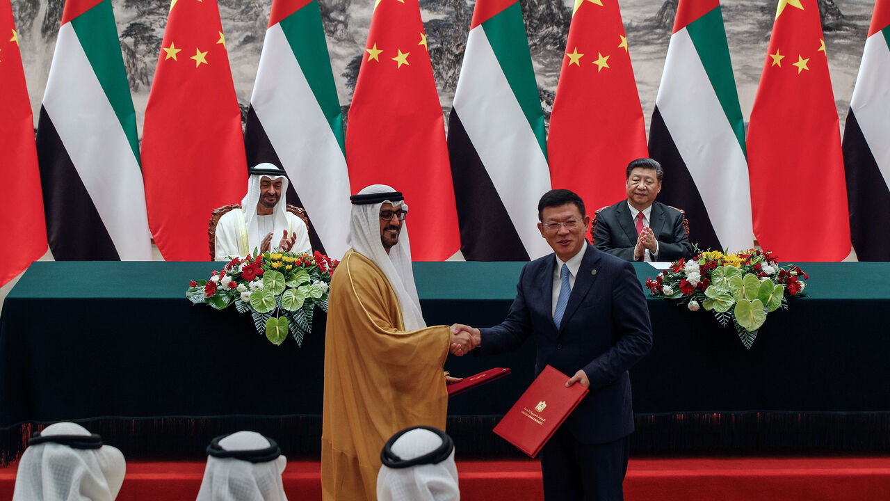 CHINA-EMIRATES/ Abu Dhabi's Crown Prince Sheikh Mohammed bin Zayed Al Nahyan and Chinese President Xi Jinpin applaud as they witness a signing ceremony at the Great Hall of the People in Beijing, Monday, July 22, 2019. Andy Wong/Pool via REUTERS - RC1F7C215B10