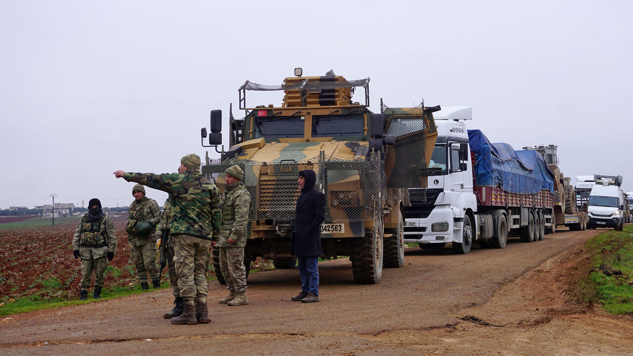 1200227982 Turkish military vehicles are pictured in the town of Binnish in Syrias northwestern province of Idlib, near the Syria-Turkey border on February 12, 2020. - Russian President Vladimir Putin and Turkish leader Recep Tayyip Erdogan discussed de-escalation of the Syrian crisis, saying Russian-Turkish agreements should be implemented in full, the Kremlin said."The importance was noted of the full implementation of existing Russian-Turkish agreements," the Kremlin said in a statement after the Putin-Erdogan phon