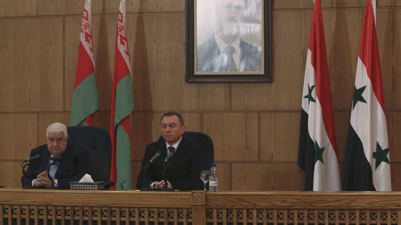 MIDEAST-CRISIS/SYRIA Syria's Foreign Minister Walid al-Moualem (R) and Belarus' Foreign Minister Vladimir Makei attend a news conference in Damascus February 9, 2015. Syria will not compromise on its sovereignty by allowing foreign troops on its soil to fight Islamic State militants, Walid al-Moualem said during a news conference on Monday. REUTERS/Omar Sanadiki (SYRIA - Tags: POLITICS CONFLICT) - GM1EB291NOL01