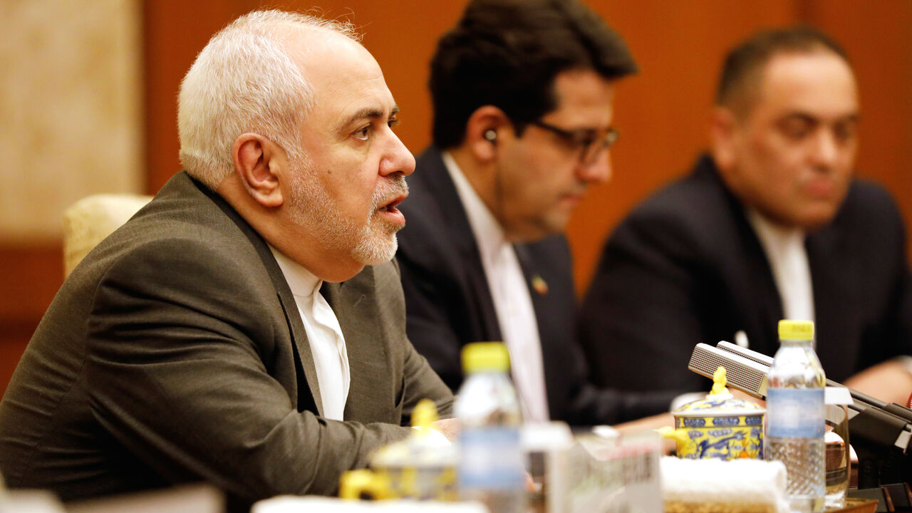 MIDEAST-IRAN/CHINA Iranian Foreign Minister Mohammad Javad Zarif (L) speaks with Chinese Foreign Minister Wang Yi (not pictured) at the Diaoyutai State Guesthouse in Beijing, China August 26, 2019. How Hwee Young/Pool via REUTERS - RC15CB7F1E50