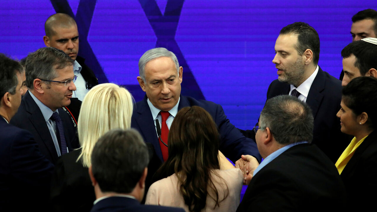 ISRAEL-NETANYAHU/ Israeli Prime Minister Benjamin Netanyahu chats with his party members after delivering a statement in Ramat Gan, near Tel Aviv, Israel September 10, 2019. REUTERS/Amir Cohen - RC181A099200