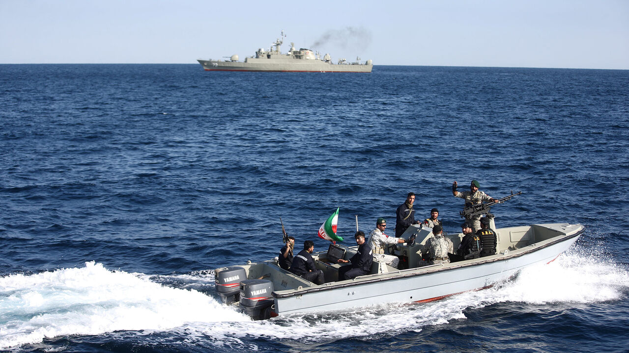 IRAN-MILITARY/RUSSIA-CHINA Iranian marine soldiers wave to the camera from a motor boat in the Sea of Oman during the third day of joint Iran, Russia and China naval war games in Chabahar port, at the Sea of Oman, Iran, December 29, 2019. Mohsen Ataei/Fars news agency/WANA (West Asia News Agency) via REUTERS ATTENTION EDITORS - THIS IMAGE HAS BEEN SUPPLIED BY A THIRD PARTY - RC235E95KV40
