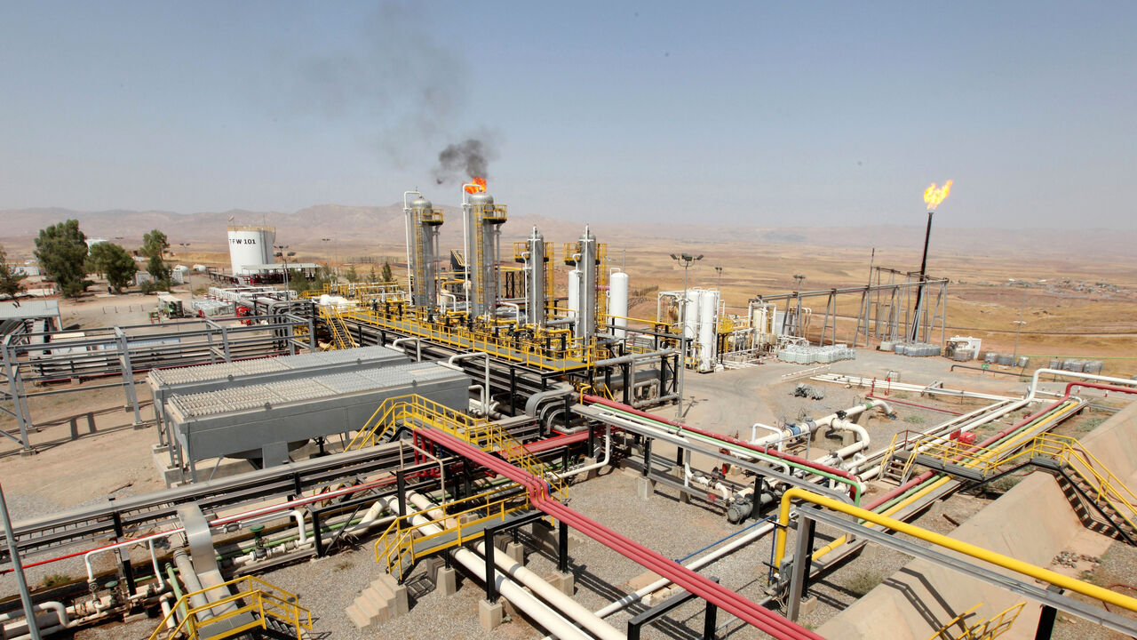IRAQ-KURDISTAN/OIL A flame rises from a chimney at Taq Taq oil field in Arbil, in Iraq's Kurdistan region, August 16, 2014. REUTERS/Azad Lashkari/File Photo - D1BETYORKTAA