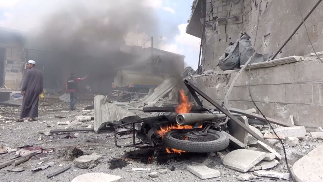 SYRIA-SECURITY/IDLIB A motorbike burns after an airstrike in this screen grab taken from a social media video said to be taken in Idlib, Syria on July 16, 2019. Picture taken July 16, 2019. White Helmets/social media via REUTERS THIS IMAGE HAS BEEN SUPPLIED BY A THIRD PARTY. - RC1FFC6630A0