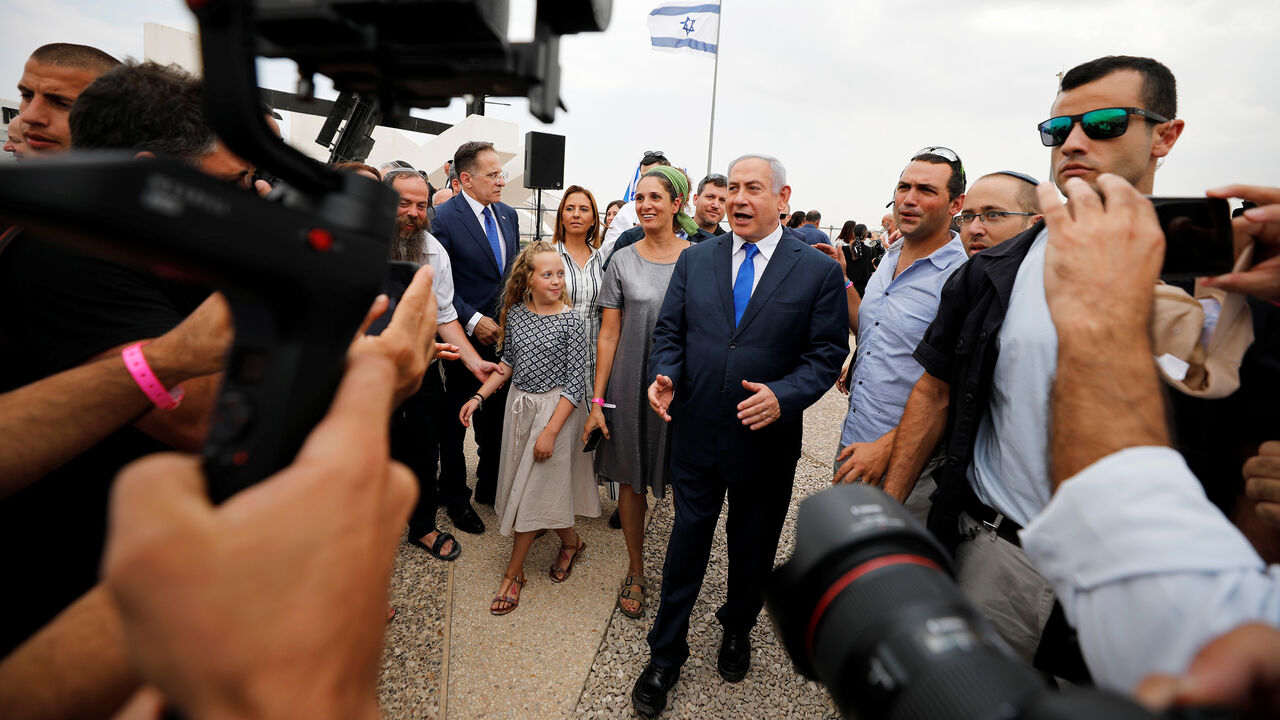 ISRAEL-ELECTION/ Members of the media work as Israeli Prime Minister Benjamin Netanyahu walks after holding a weekly cabinet meeting in the Jordan Valley, in the Israeli-occupied West Bank September 15, 2019. REUTERS/Amir Cohen - RC1DC97D0610