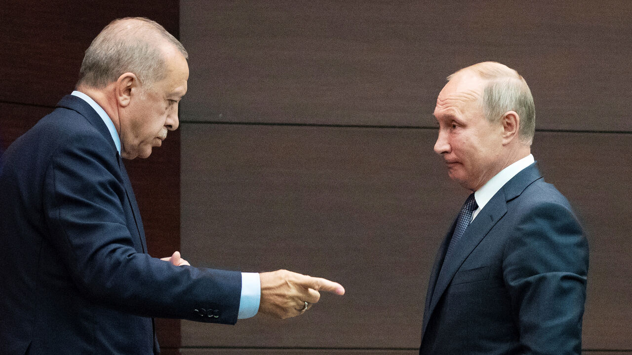 SYRIA-SECURITY/SUMMIT Russian President Vladimir Putin and Turkish President Tayyip Erdogan talk after a joint news conference with Iranian President Hassan Rouhani in Ankara, Turkey, September 16, 2019. Pavel Golovkin/Pool via REUTERS - RC18FEF72E00