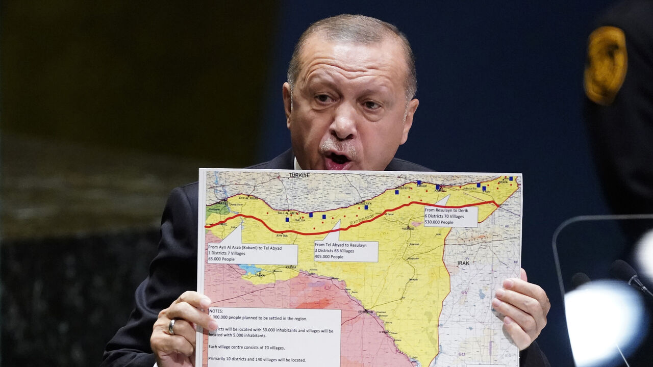 UN-ASSEMBLY/ Turkey's President Recep Tayyip Erdogan holds up a map as he addresses the 74th session of the United Nations General Assembly at U.N. headquarters in New York City, New York, U.S., September 24, 2019. REUTERS/Carlo Allegri - HP1EF9O183U9F