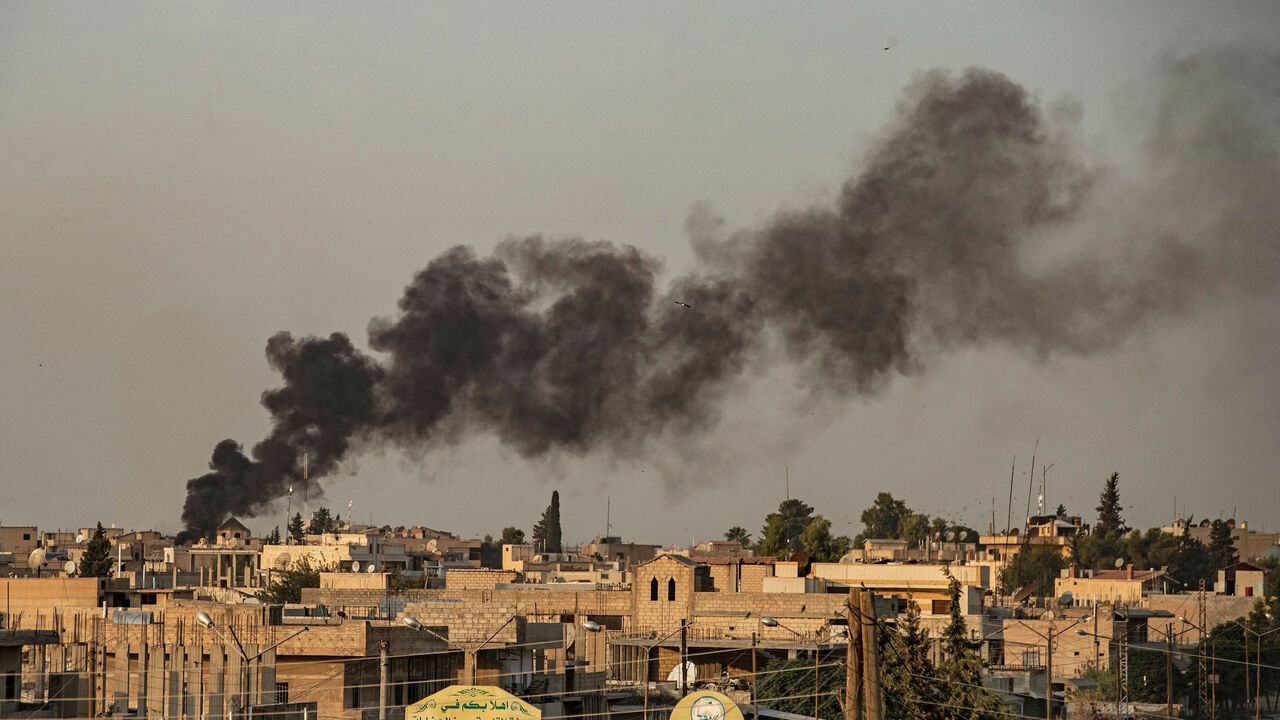 1174721460 TOPSHOT - Smoke billows following Turkish bombardment on Syria's northeastern town of Ras al-Ain in the Hasakeh province along the Turkish border on October 9, 2019. - Turkey launched an assault on Kurdish forces in northern Syria with air strikes and explosions reported along the border. President Recep Tayyip Erdogan announced the start of the attack on Twitter, labelling it "Operation Peace Spring". (Photo by Delil SOULEIMAN / AFP) (Photo by DELIL SOULEIMAN/AFP via Getty Images)