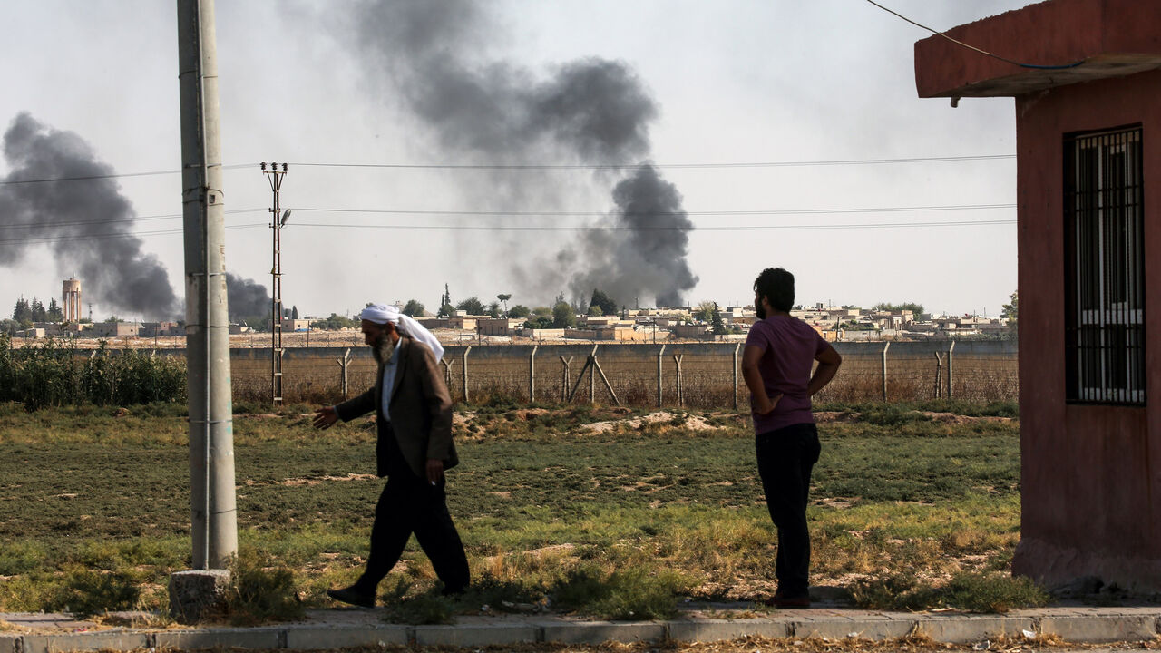 1174970053 SANLIURFA, TURKEY - OCTOBER 10: A photo taken from Turkey's Sanliurfa province, on October 10, 2019 shows dark smoke rises at the site of Tell Abyad city of Syria after terrorists burnt tires to avoid being photographed by Turkish National Army's unmanned aerial vehicles (UAV) as Turkish troops along with the Syrian National Army begin Operation Peace Spring in northern Syria against PKK/YPG, Daesh terrorists. (Photo by Arif Hudaverdi Yaman/Anadolu Agency via Getty Images)