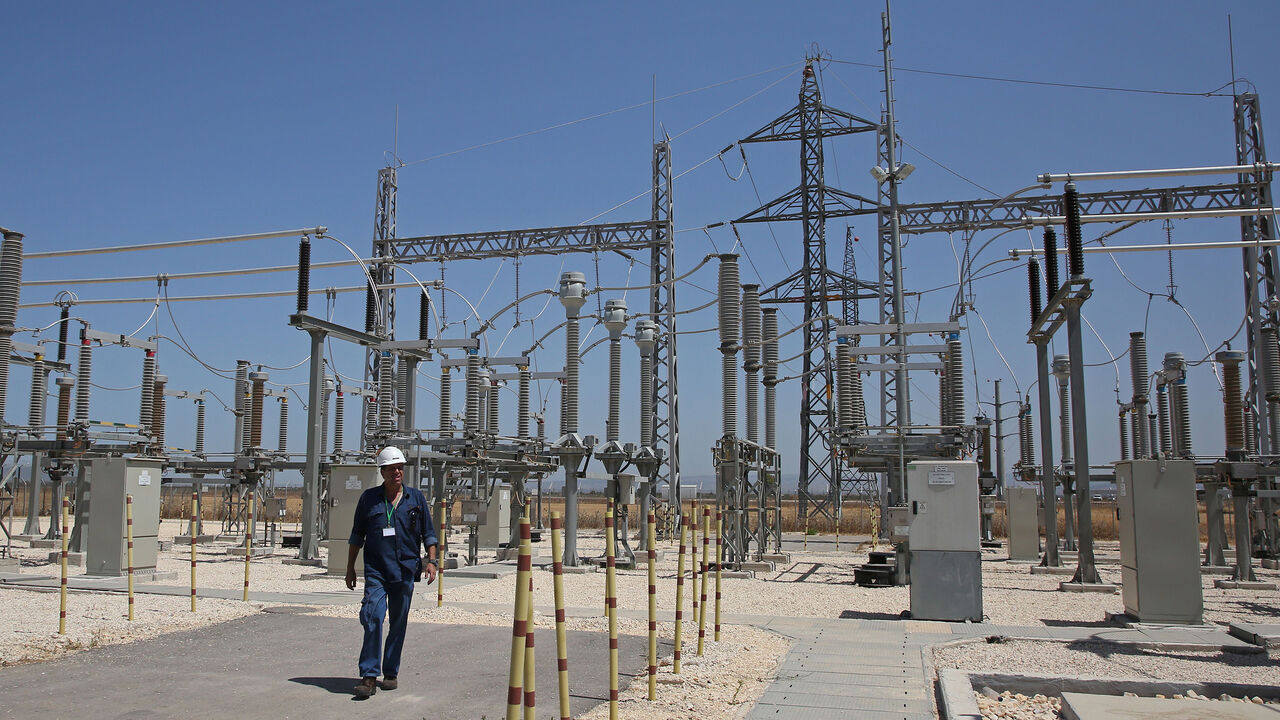 A worker walks at the site where a new electricity plant will be built in Jalamah, near the West Bank town of Jenin, following the signing of a new contract on July 10, 2017.
Israel Energy Minister Yuval Steinitz made a rare appearance by a high-ranking Israeli official in the occupied West Bank to sign the agreement on electricity with the Palestinian Authority. / AFP PHOTO / JAAFAR ASHTIYEH        (Photo credit should read JAAFAR ASHTIYEH/AFP via Getty Images)
