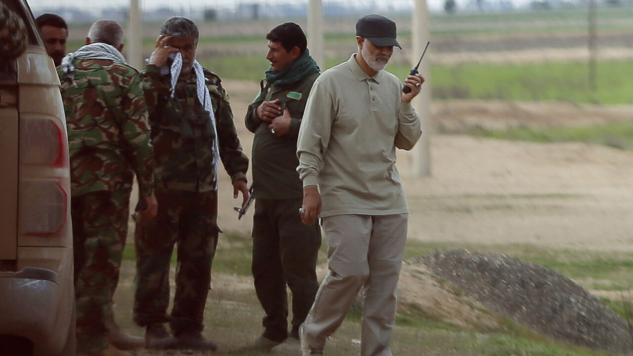 MIDEAST-CRISIS/IRAQ Iranian Revolutionary Guard Commander Qassem Soleimani uses a walkie-talkie at the frontline during offensive operations against Islamic State militants in the town of Tal Ksaiba in Salahuddin province March 8, 2015. Picture taken March 8, 2015. REUTERS/Stringer (IRAQ - Tags: CIVIL UNREST CONFLICT POLITICS) - GM1EB3I1GO301