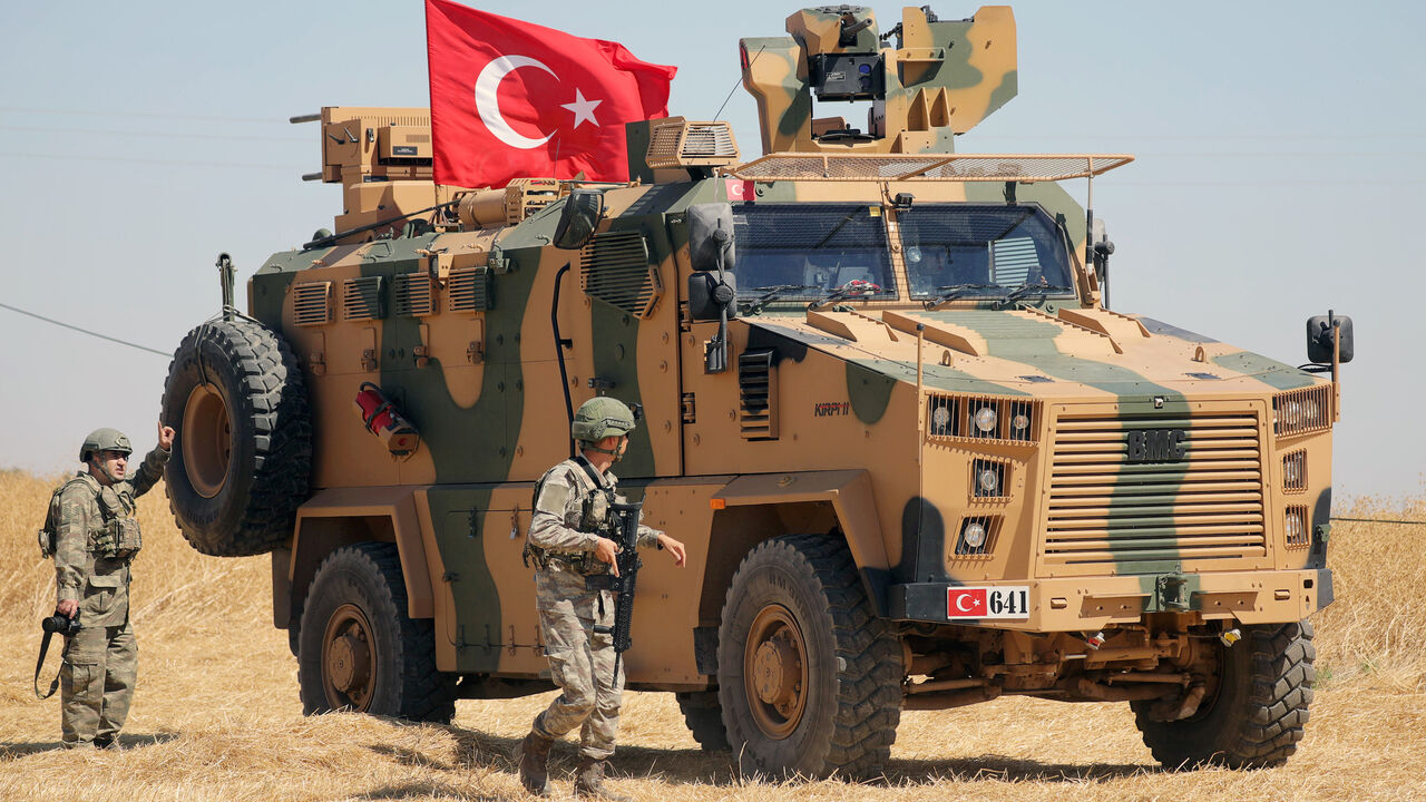 SYRIA-SECURITY/TURKEY A Turkish soldier walks next to a Turkish military vehicle during a joint U.S.-Turkey patrol, near Tel Abyad, Syria September 8, 2019. REUTERS/Rodi Said - RC1CFC59FD70