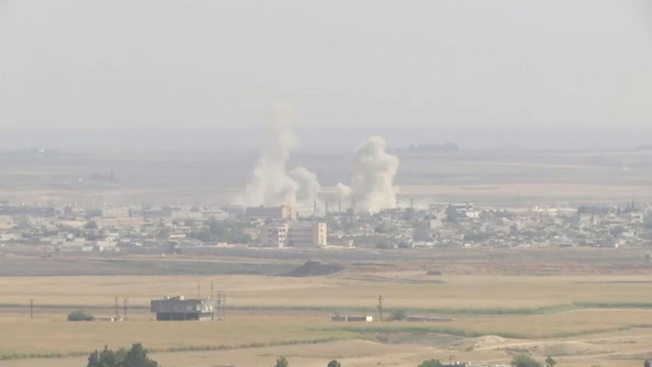SYRIA-SECURITY/TURKEY-USA Smoke billows out after Turkish shelling on the Syrian border town of Ras Al Ain, as seen from Ceylanpinar, Turkey, October 11, 2019 in this still image taken from a video. REUTERS/ReutersTV - RC1DE85B2330
