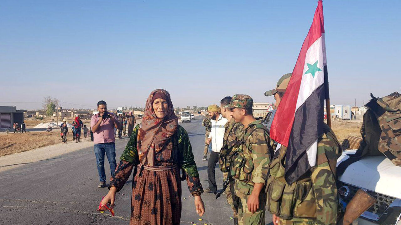 MIDEAST-SECURITY/ARMY-TOWN Syrian army soldiers are seen in the town of Tel Tamer in northeast Syria, in this handout released by SANA on October 14, 2019. SANA/Handout via REUTERS ATTENTION EDITORS - THIS IMAGE WAS PROVIDED BY A THIRD PARTY. REUTERS IS UNABLE TO INDEPENDENTLY VERIFY THIS IMAGE. - RC18459B82D0