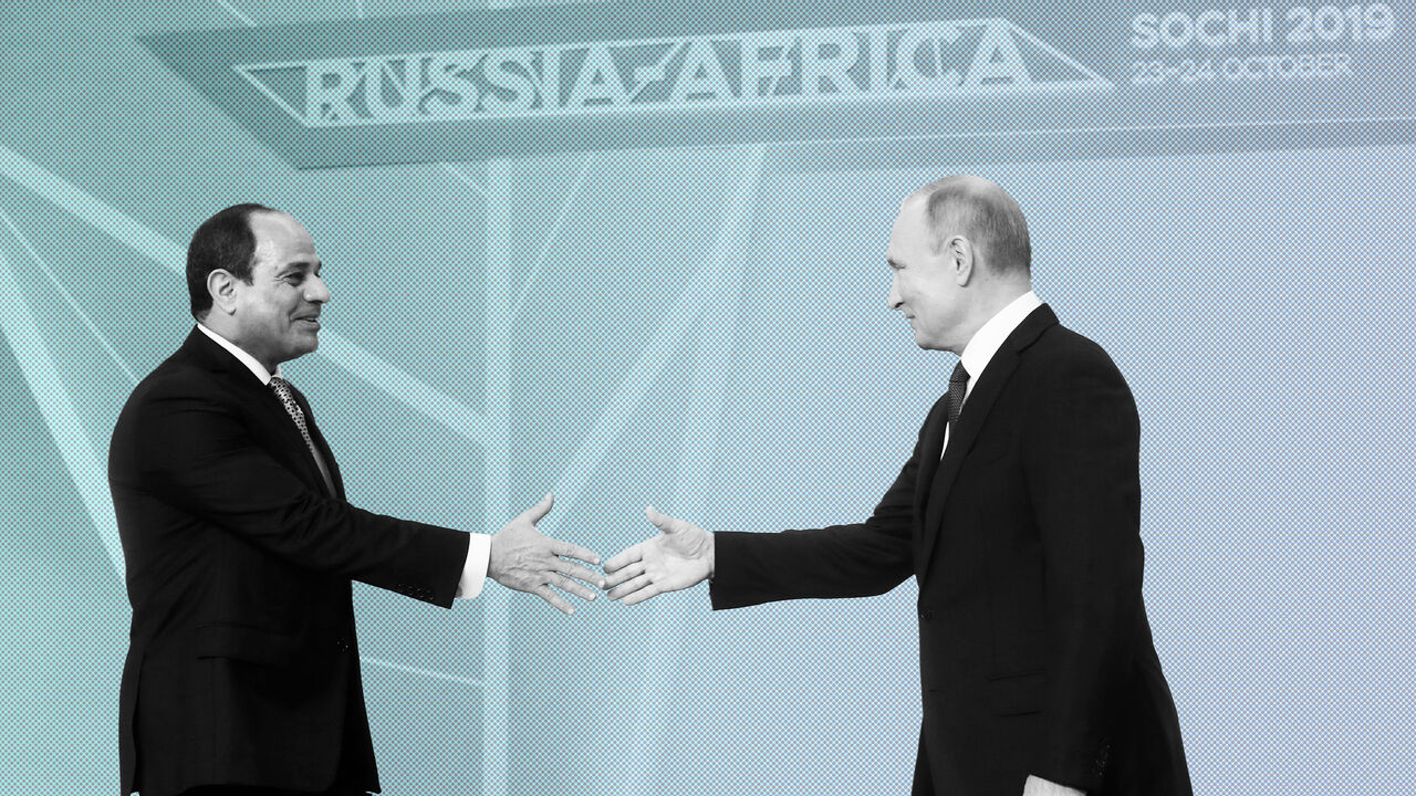 RUSSIA-EGYPT/PUTIN-SISI Egyptian President Abdel Fattah el-Sisi shakes hands with Russian President Vladimir Putin during an official welcome ceremony for heads of states and governments of member-states of Russia-Africa Summit in the Black sea resort of Sochi, Russia, October 23, 2019. Sergei Chirikov/Pool via REUTERS - RC12F4C89E10