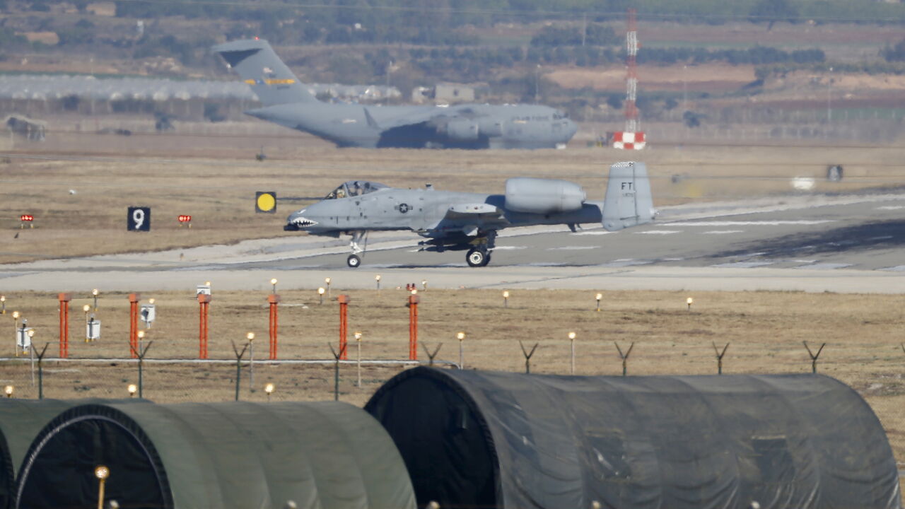 MIDEAST-CRISIS/TURKEY A U.S. Air Force A-10 Thunderbolt II fighter jet (foreground) lands at Incirlik airbase in the southern city of Adana, Turkey, December 11, 2015. REUTERS/Umit Bektas - GF10000262265